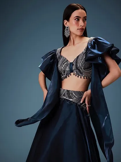 A full-length view of the glamorous look for Kalki Fashion. The sleek hair and glowing makeup are perfect for this evening wear piece, creating a polished and high-end feel.