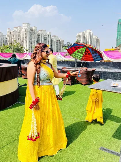 A candid shot from a Haldi ceremony. The client's fun, braided hairstyle and bright yellow outfit capture the joyful spirit of the event. I create looks that are not only beautiful but also practical for every function.