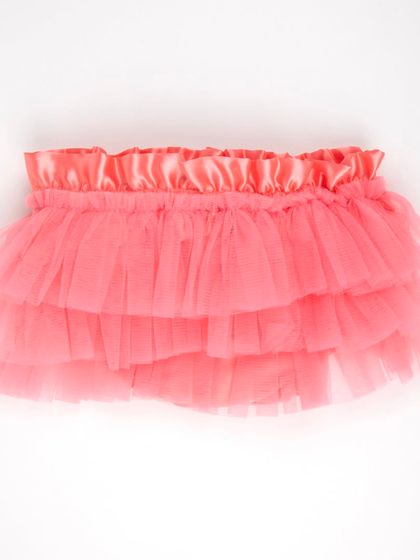 The front view of the coral-colored tulle tutu skirt.