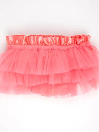 The front view of the coral-colored tulle tutu skirt.