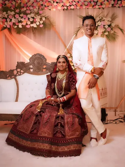 Another beautiful portrait of the couple, capturing their happiness against a beautifully decorated backdrop.