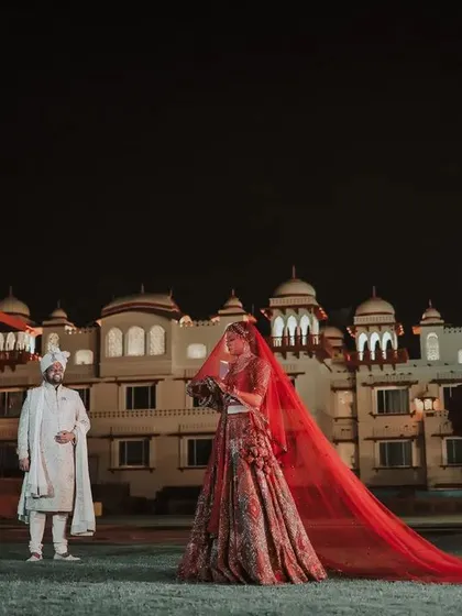 A destination wedding against a palace backdrop. This shot showcases my ability to capture the grandeur of your venue while keeping the focus on you, creating a truly epic wedding portrait.