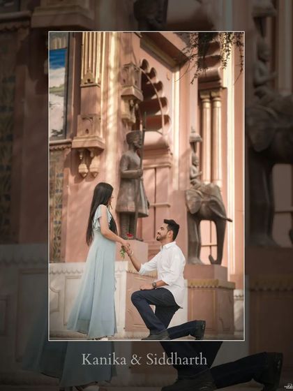 A romantic proposal moment captured at Patrika Gate, with the groom on one knee in front of the intricately painted walls.