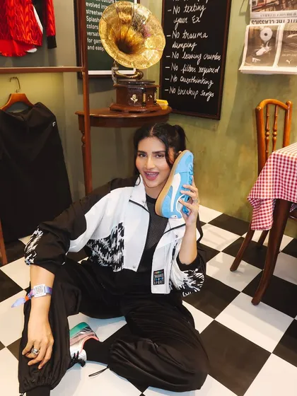 Posing with a light blue Puma Palermo, showcasing one of the many available color options.