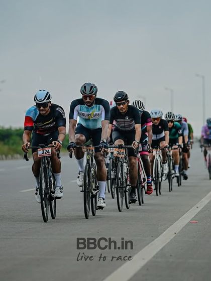The masters peloton, a long line of riders stretching down the highway.