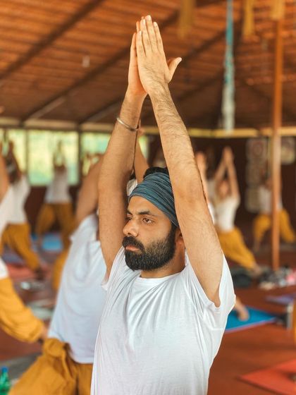 This is a duplicate of image 149. A student's focused gaze in Warrior I captures the mental and physical discipline of asana practice.