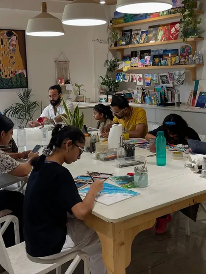Another view of a busy day at the studio. You can see our shelves stocked with art supplies and books, ready to inspire the next creation.
