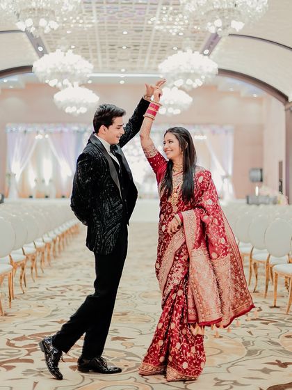 The couple shares a dance in the ballroom, a classic and timeless reception moment that we capture with grace.