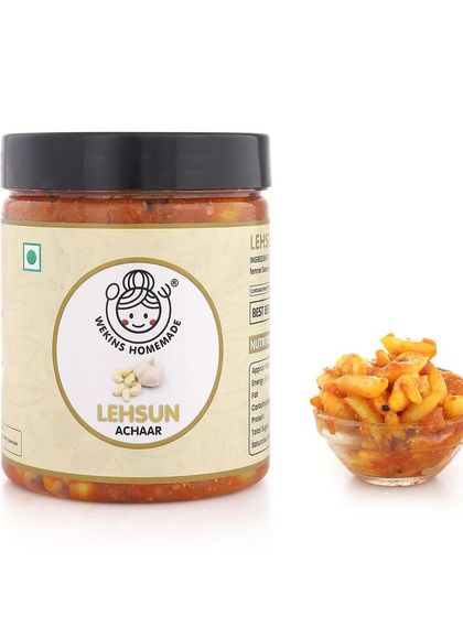 A jar of our Lehsun Achaar next to a sample bowl. It's everyone's favorite and absolutely delicious.