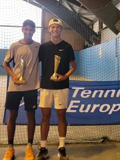 Tavish Pahwa and his partner with their doubles championship trophies from the U14 Category 1 European ranking tournament. These victories are important milestones.