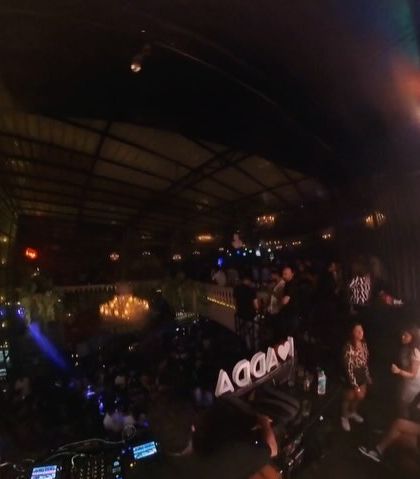 A wide shot from the DJ console, showing the depth of the venue.