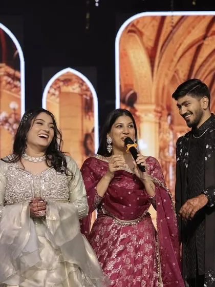 Sharing a candid moment with the happy couple on their Sangeet stage. I focus on creating a comfortable and fun atmosphere where their personalities can truly shine.