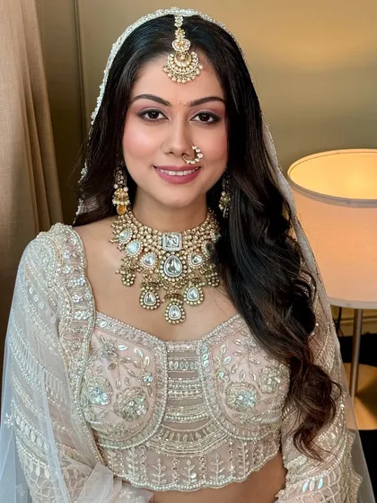 A close-up of this soft and glamorous look. The makeup enhances her features without overpowering them, creating a look of pure elegance.