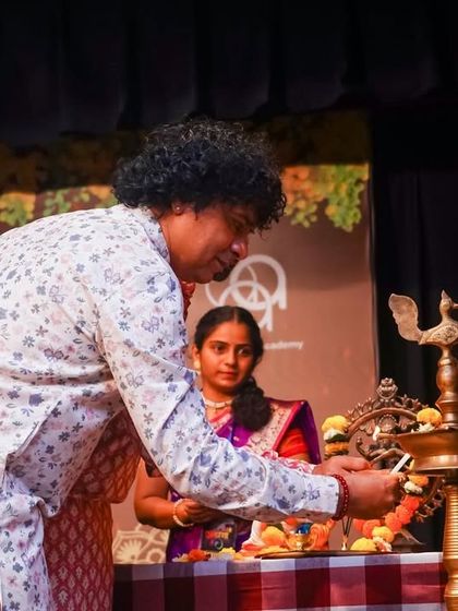 My Guru, Dr. G. Ratheesh Babu, lighting the lamp at Antaranga. His guidance is the light that leads our academy.