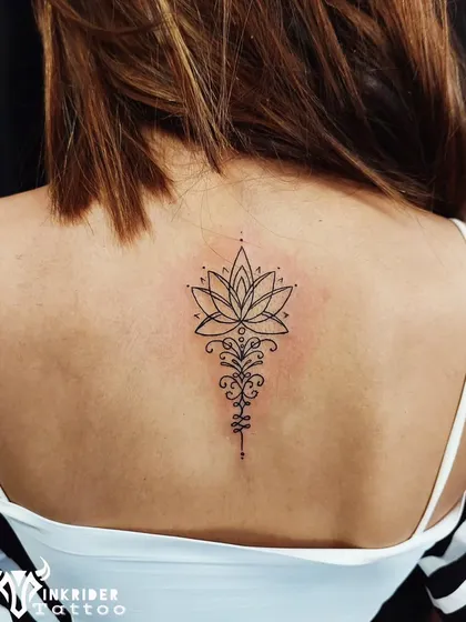 The Unalome lotus represents the path to enlightenment. We crafted this design with fine lines for the back, creating an elegant and meaningful piece that follows the spine.