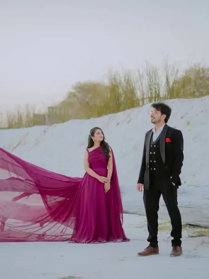 A classic pose with a modern twist. The couple's stylish outfits and the unique, stark background of Kishangarh create a very fashionable pre-wedding photograph.