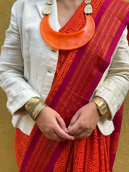We believe in giving beautiful textiles a second life. This image showcases our overprinting service, where we take a pre-loved vintage Kanjeevaram silk saree from our founder's personal collection and refresh it with a vintage 'chunadi' block print.