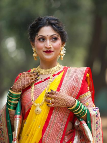 A close-up portrait showcasing the bold lip and winged eyeliner.