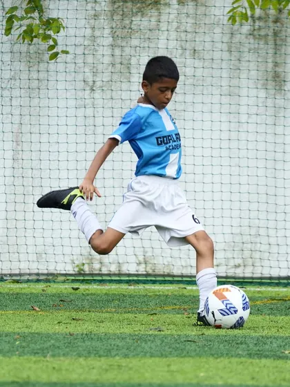 Perfecting the kicking technique. This action shot captures the form and power we teach our players to develop in their striking ability.