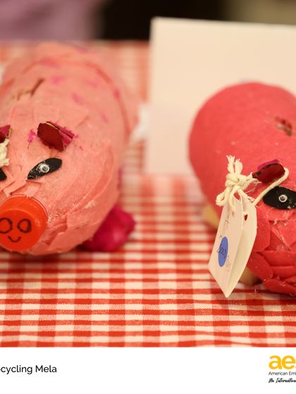 A close-up of adorable piggy banks made from repurposed materials. This project proves that with a little creativity, waste can be transformed into something new and valuable.