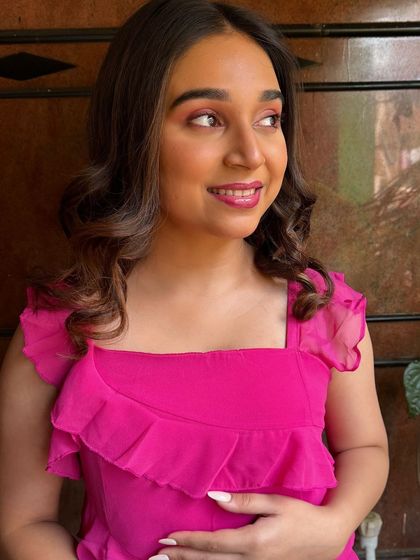 A candid, happy moment from a shoot. It's important that the makeup looks just as good in motion and with natural expressions as it does in a posed photo.