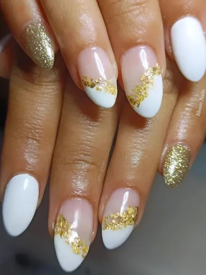 A modern and chic design featuring a combination of solid white, negative space, and gold foil. The gold leaf is carefully placed to create an abstract pattern that is both artistic and sophisticated.