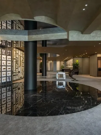 Additional views of the Gala showroom, showcasing the luxurious walk-in closet displays, the reflective marble floor, and the seamless integration of product showcases into the architectural design.