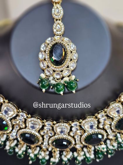 The maang tikka for this set is designed to perfectly complement the necklace.