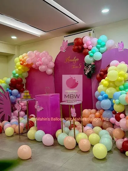 Another view of the modern butterfly party, showing the full setup with balloons scattered on the floor, creating a fun and playful atmosphere.