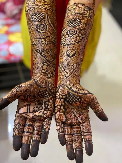 The full view of both arms, showcasing the complete bridal look.
