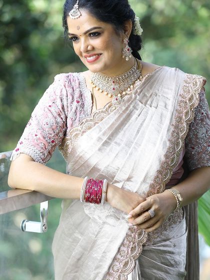 Photos from my housewarming, wearing a saree and blouse I designed myself. I took a plain tissue saree and completely transformed it with a hand-worked scalloped border and a custom-stitched velvet blouse. It’s a look that’s very close to my heart.