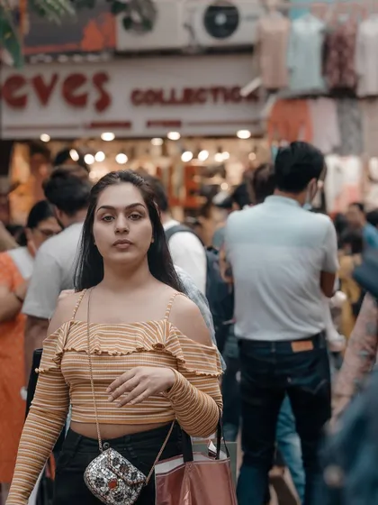 This woman looked directly at my camera for a split second in the busy market. That brief connection can make for a powerful and engaging street portrait.