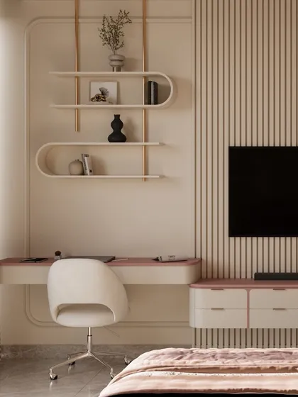 In this sophisticated teen room, a floating desk in blush and beige creates a sleek study space. Above it, organic-shaped shelves provide an artistic display for books and decor, blending form and function seamlessly.