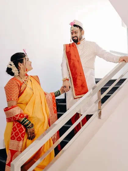 A sweet moment between the bride and groom on a staircase. I use the environment to frame the couple and tell a story of their journey together.