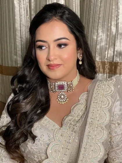 Krusha looked like a dream on her sangeet night. We created a soft glam look with a focus on luminous skin and a subtle smokey eye to complement her beautiful white and silver lehenga. ✨🤍