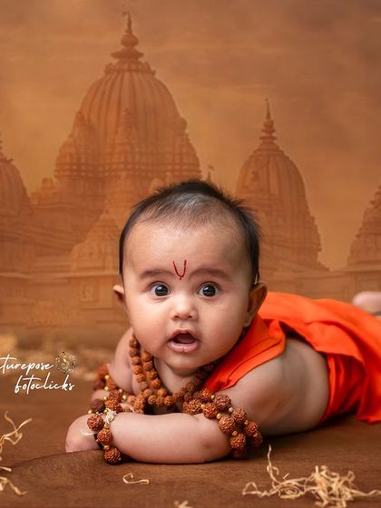 A curious and expressive pose from our three-month-old Rama, showing that our divine themes are suitable for babies of all ages.