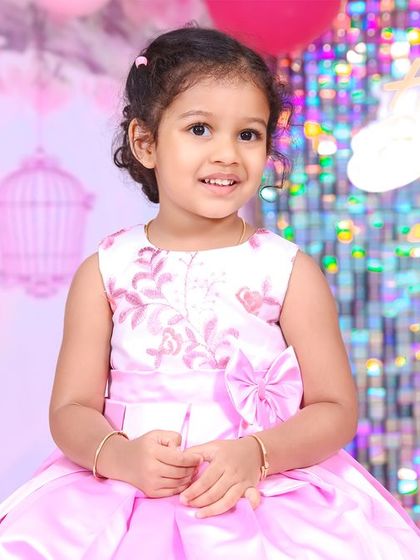 A magical 'Princess' themed birthday party, with elegant decor, shimmering backdrops, and royal props, making every little girl feel like royalty.