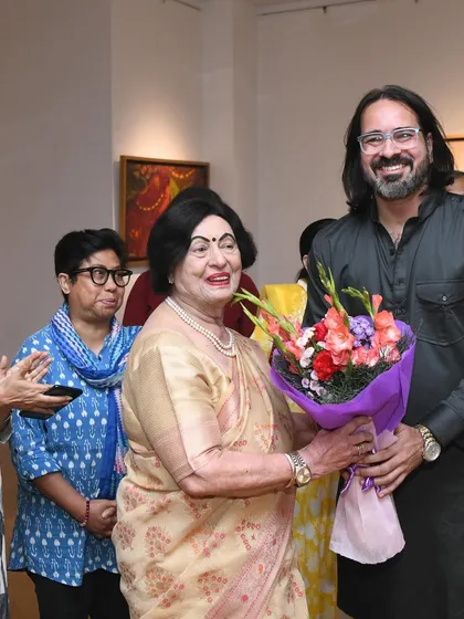 A happy moment receiving flowers from a distinguished guest at the opening ceremony. The warmth and support from the community is truly humbling.