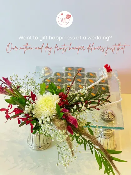 Blending tradition with modern elegance, this hamper features artisanal mithai and premium dry fruits, beautifully presented with fresh flowers. It’s a classic gift of blessings and sweetness, thoughtfully reimagined.