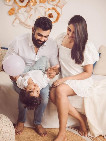 Playful moments are the best moments. We encourage tickle fights and games to bring out the most natural smiles during our family photoshoots.