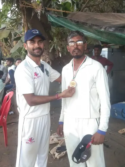 A player receives a medal for his performance in the first round of the MCA Maidan Club tournament.