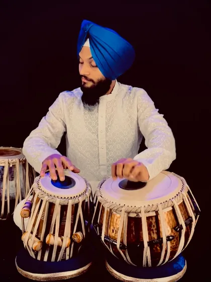 Another portrait from my photoshoot. The vibrant blue of my turban contrasts with the natural wood of the tabla.