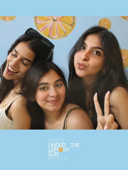 Friends making memories at the PTAT pop-up. The instant prints are a great way for guests to remember the day.