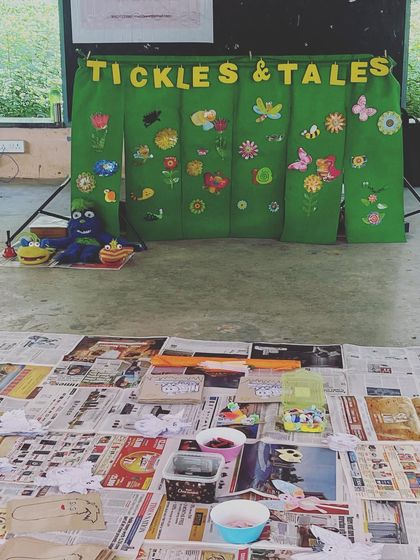 My setup ready for a craft workshop at a community event. I love creating a welcoming and fun space for kids to get creative.