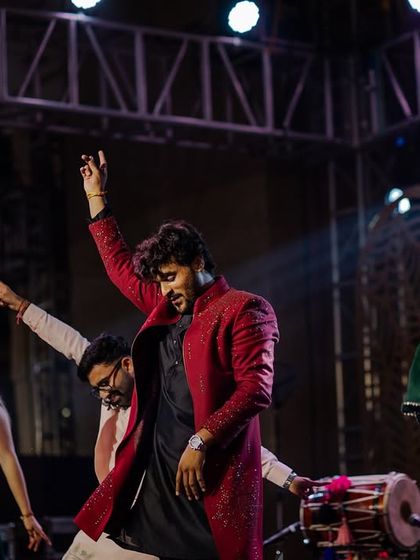 A dynamic shot of a group dance performance at the Udaipur destination Sangeet.