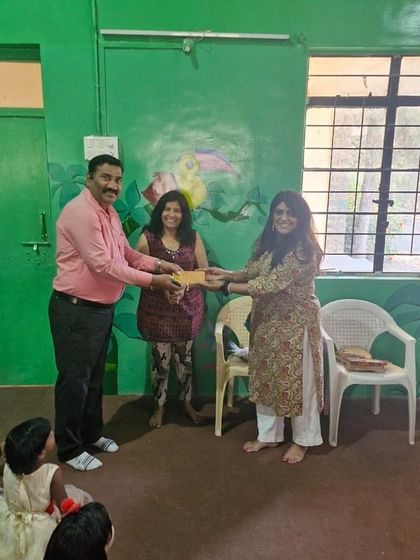 The kids were thrilled to learn their creations captivated so many. Here, our founder presents a gift to one of our partner locations, thanks to our Chicago donors.