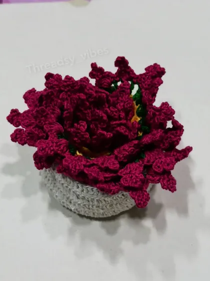 This is the crocheted holder I provide with my coaster sets, filled with the floral coasters. It keeps everything tidy and looks cute on a shelf.