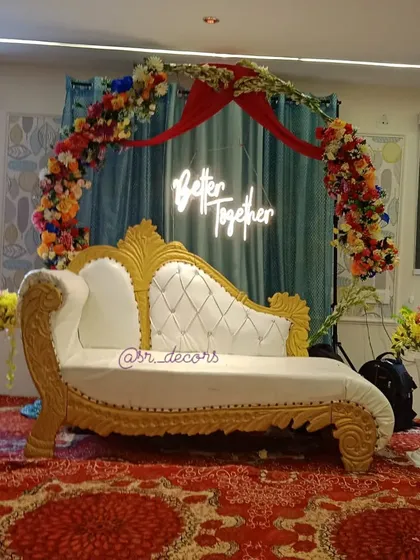 This is how I set the stage for your engagement. I provide an elegant couple's sofa, a beautiful floral arch, and a trendy 'Better Together' neon sign for that perfect romantic vibe.