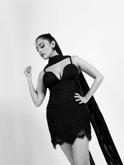 A classic, poised three-quarter portrait that exudes timeless Hollywood glamour.