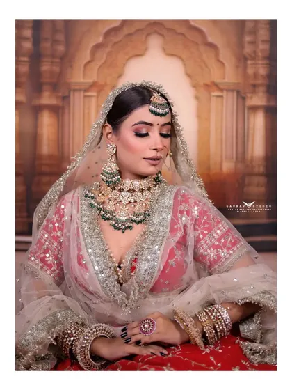 Another beautiful close-up, focusing on the flawless makeup and the intricate design of the bridal jewelry.